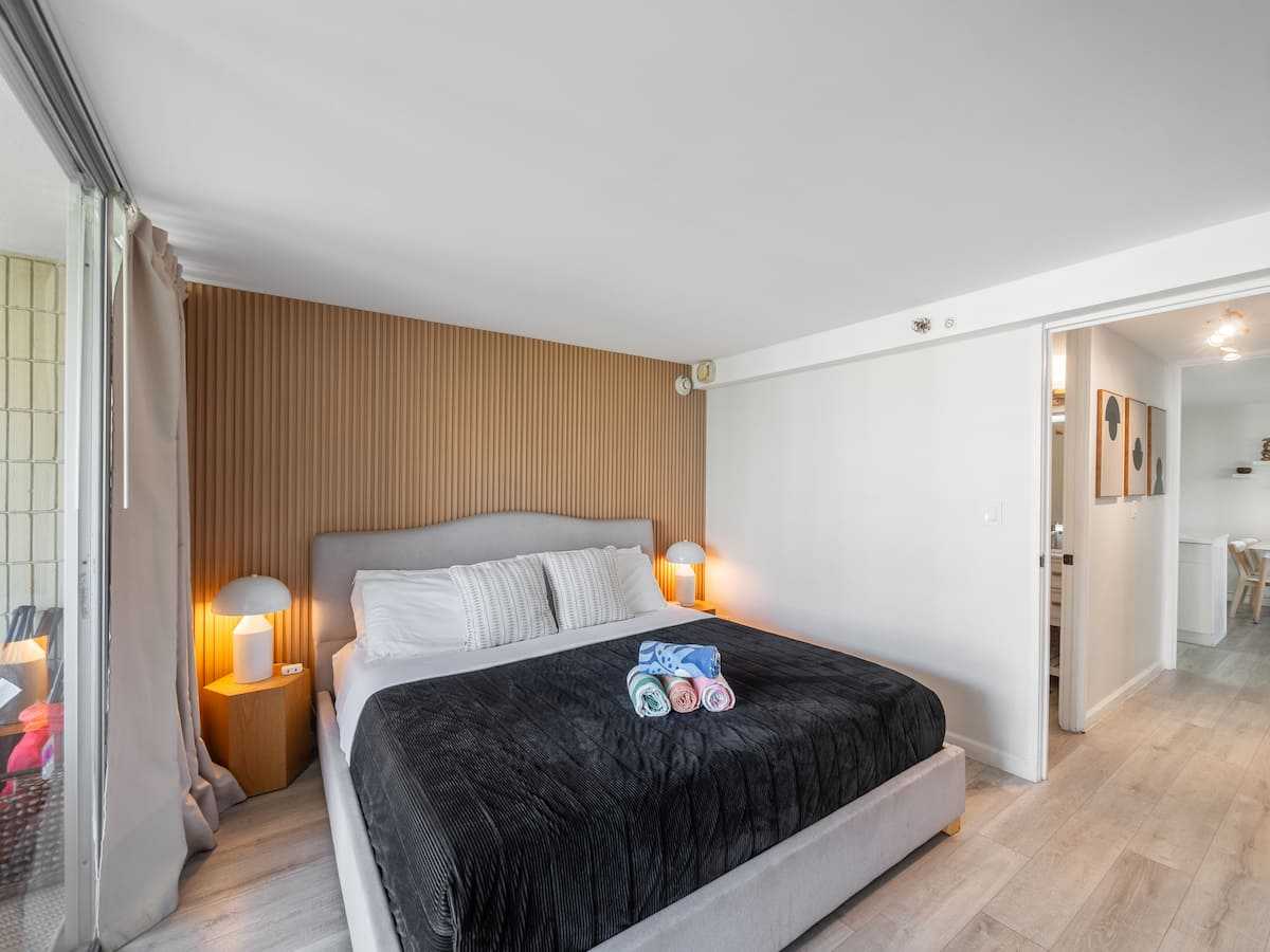 King bed in the private bedroom, viewed from the window side