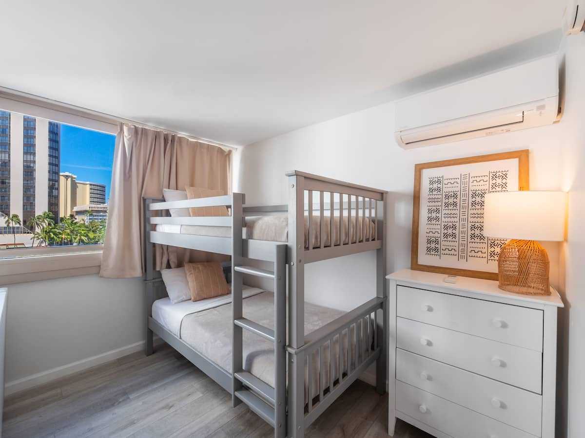 Bunk beds beside a dresser in the living area