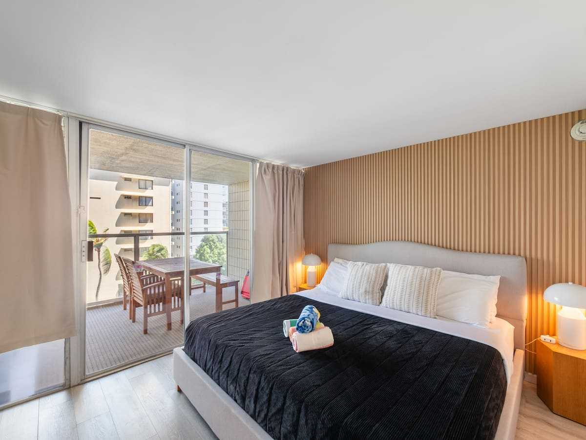 King bedroom with the private lanai visible through the windows