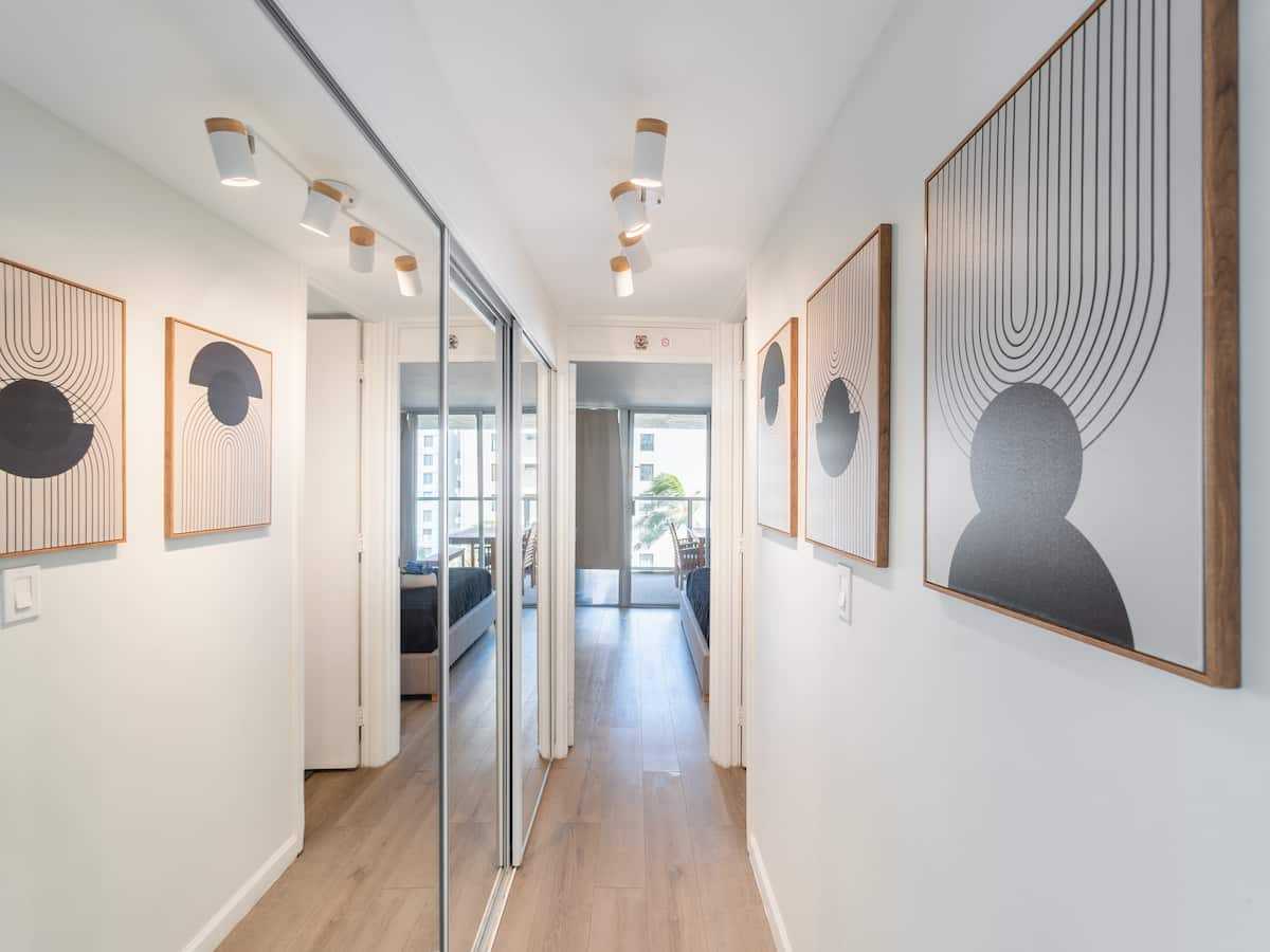 Hallway with mirrored closet doors