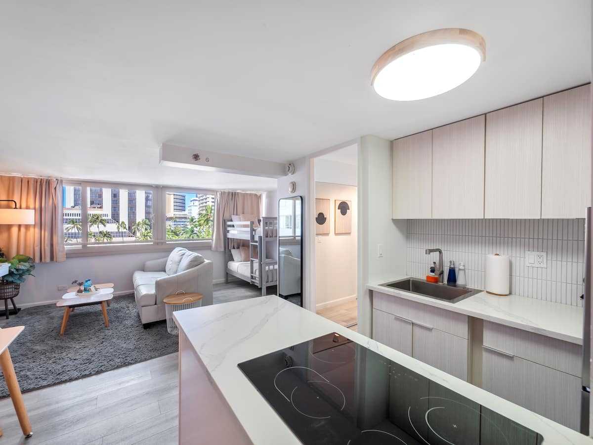 Kitchen peninsula opening into the living room