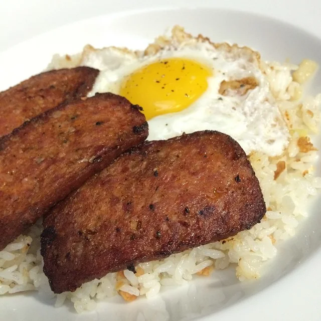 Portuguese sausage, a fried egg and garlic fried rice.