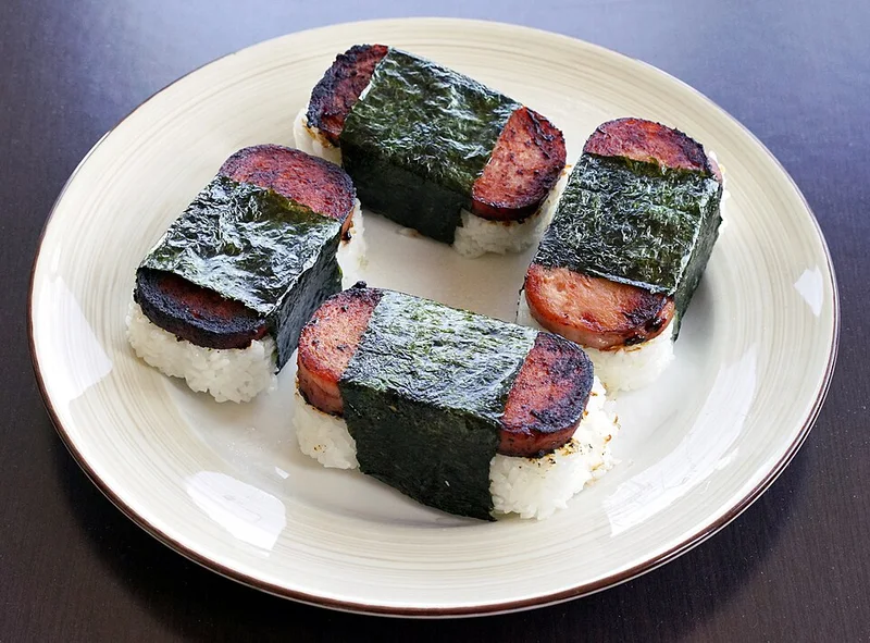 Three Spam musubi wrapped with nori.
